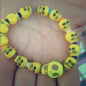 A sugar skull sun braclet